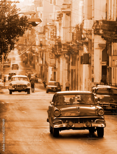 A classic car driving in a street in Havana. These old and classic cars are an iconic sight of the island © corlaffra