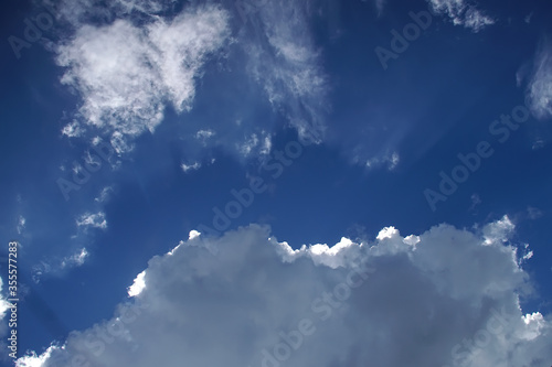 Dramatic clouds with blue sky background.