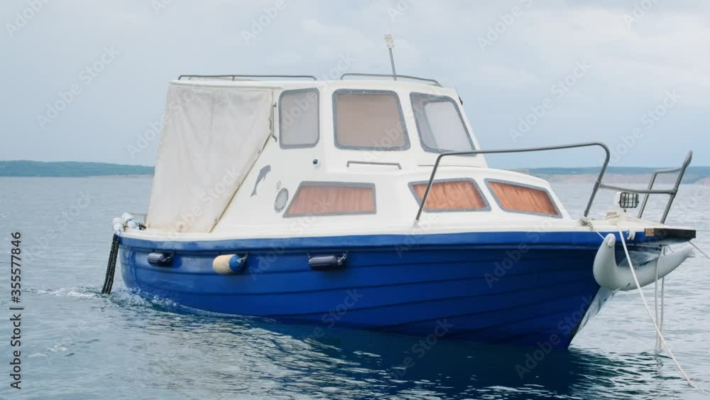 Slow motion shot: Fishing boat sways in the waves. 4k Slow motion shot: Fishing boat sways in the waves. 4k