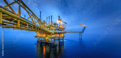 Industry of oil offshore jack up rig at gulf in the time after sunset Fototapete