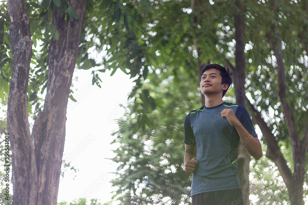 asian young fitness man runner running at the park asian young fitness man runner running at the park
