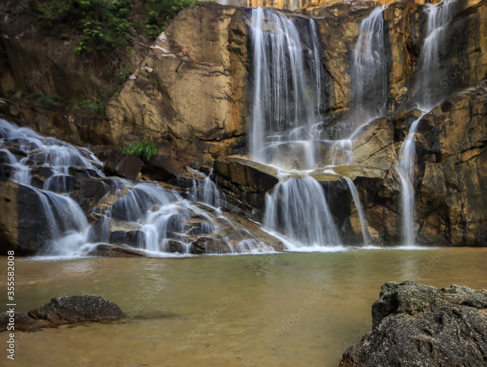 Waterfall found in tropical rainforest in malaysia Waterfall found in tropical rainforest in malaysia