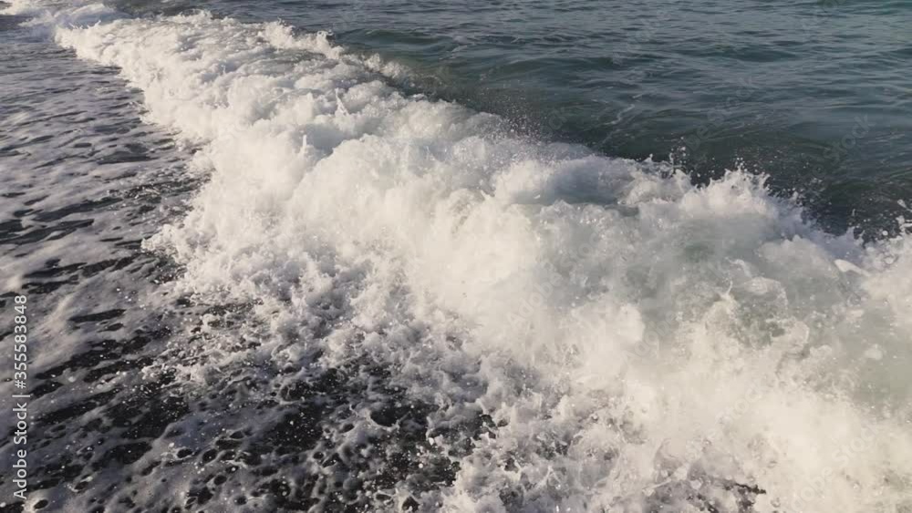 Close up of waves crashing on an empty beach Close up of waves crashing on an empty beach