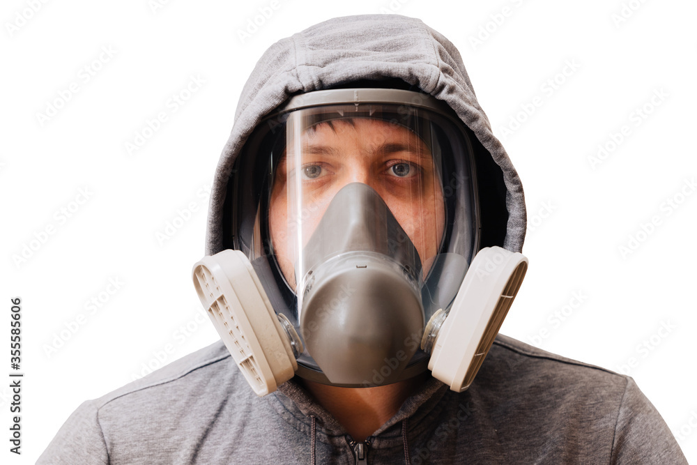 A man in a respirator mask with an increased degree of protection against harmful environmental factors. Full face mask. A man in a respirator mask with an increased degree of protection against harmful environmental factors. Full face mask.