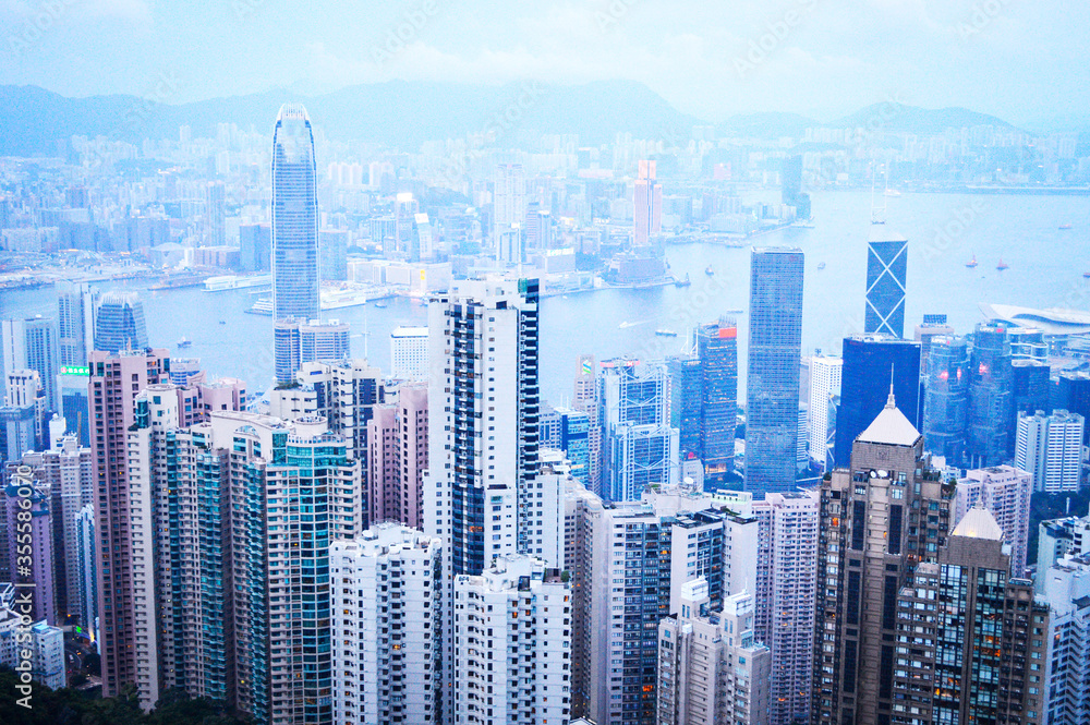 Obraz premium Top View of Hong Kong City Skyscrapers and Victoria Harbour from The Peak.