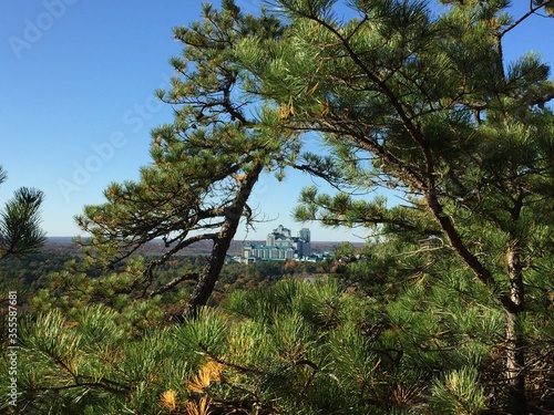 View from the Lantern Hill hiking trail with Foxwoods Resort Casino in Mashantucket, Connecticut seen through the trees