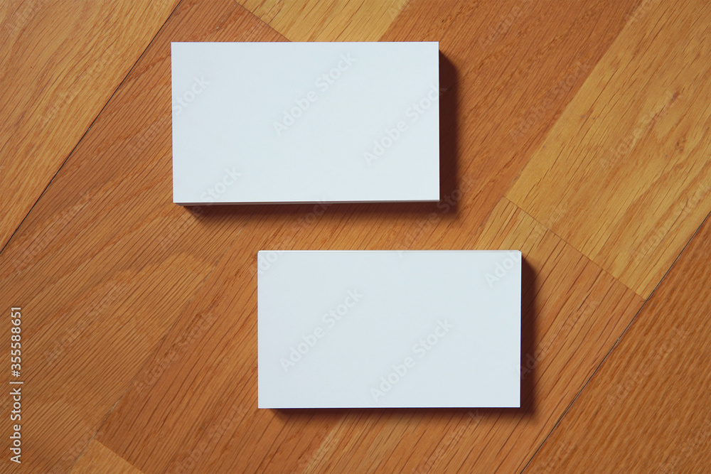 Business card on wooden background. Blank name card for company logo, Branding Mock-up. Flat lay. Copy space for text Business card on wooden background. Blank name card for company logo, Branding Mock-up. Flat lay. Copy space for text