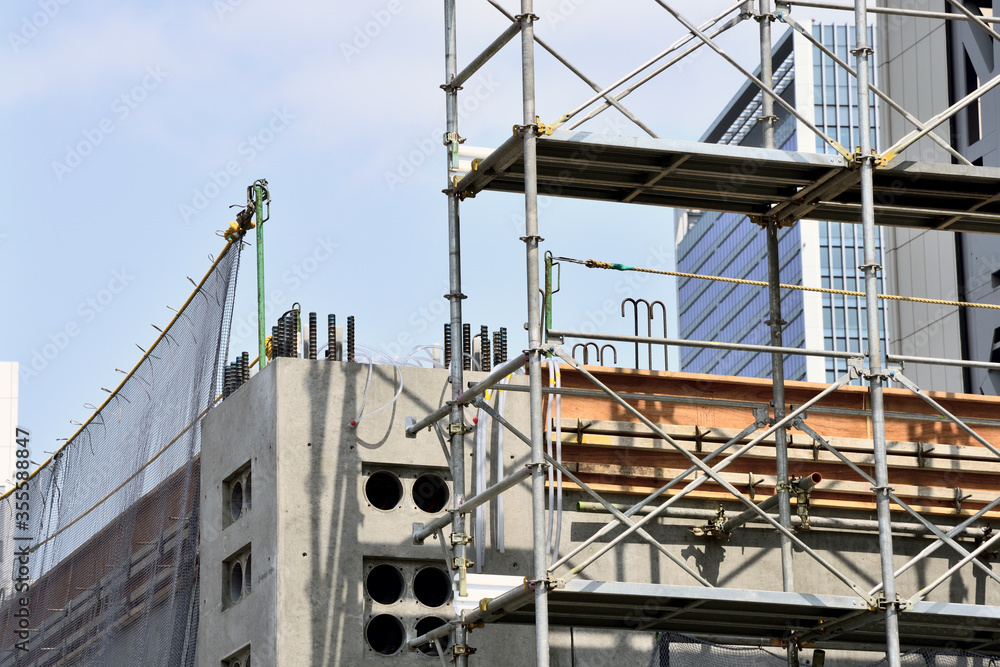 scaffolding at the high-rise building site: Construction industry
