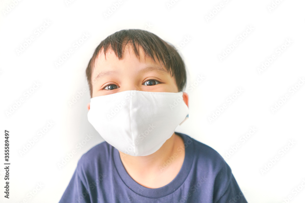 young asian boy with Facial mask isolated on white background young asian boy with Facial mask isolated on white background