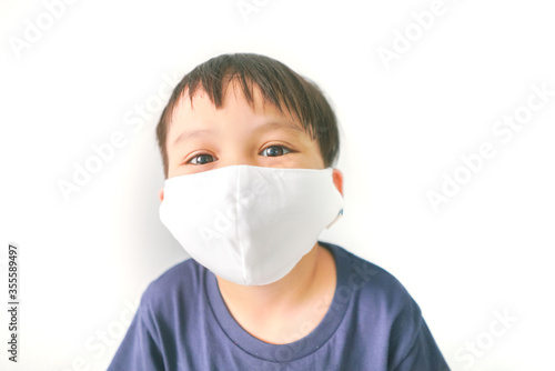 young asian boy with Facial mask isolated on white background 