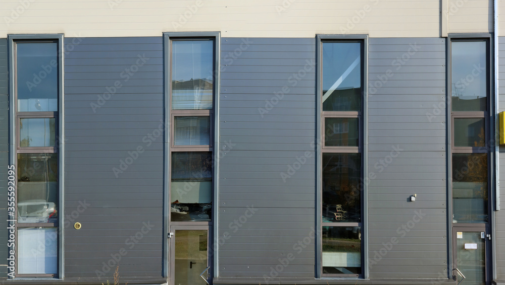 Glass windows and doors in the modern office building Glass windows and doors in the modern office building