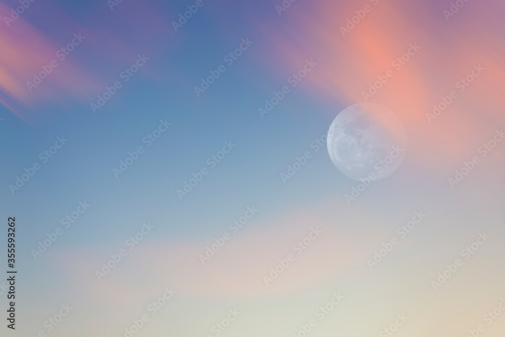 cloudy and full moon on blue sky with a pastel color background. cloudy and full moon on blue sky with a pastel color background.