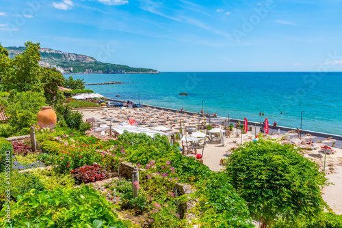 BALCHIK, BULGARIA, JULY 13, 2019: People are enjoying a sunny day on a beach in Balchik, Bulgaria photo