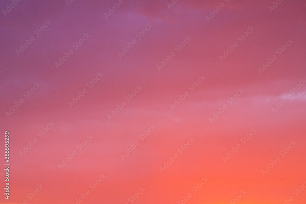 Obraz premium Blurred color glamor pink evening sky background for design concept. Abstract natural pastel color background. all colors are pink in the sky. Artistically blurry