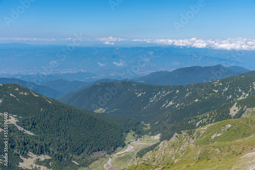 forests spreading on hills of Pirin national park in Bulgaria photo