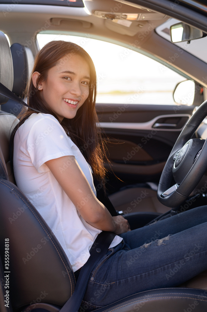 Asian woman driving a car Asian woman driving a car