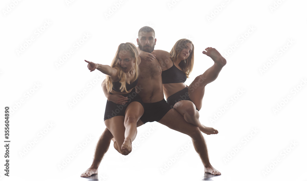 group of athletic dance partners in front of white background group of athletic dance partners in front of white background