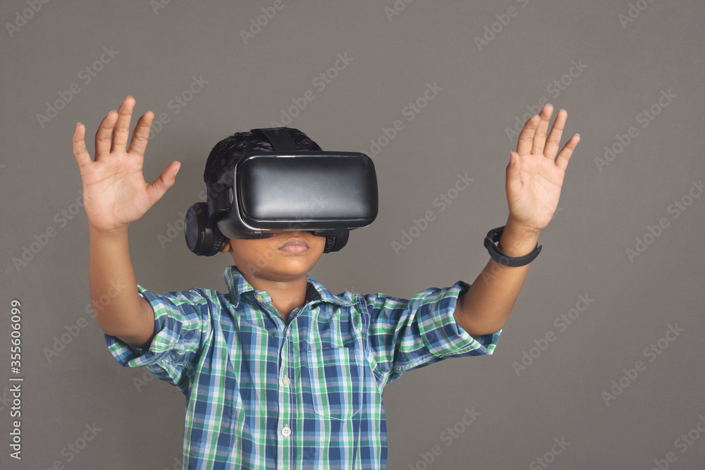 Portrait of Indian little boy wearing Virtual Reality Glasses Portrait of Indian little boy wearing Virtual Reality Glasses