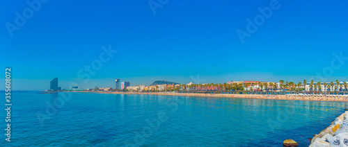 Photography Summer day at Barceloneta beach in Barcelona, Spain