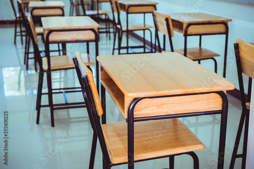 Back to school concept. School empty classroom  Lecture room with desks and chairs iron wood for studying lessons in highschool thailand without young student  interior of secondary education