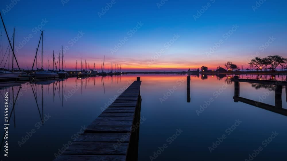 Complete Sunrise with mirror reflection, boats and steg Complete Sunrise with mirror reflection, boats and steg