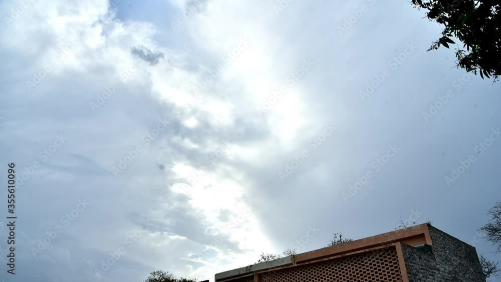 Moving clouds over the roof with sunshine Moving clouds over the roof with sunshine