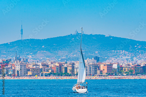 Cityscape of Barcelona with Tibidabo mountain viewed from Mediterranean sea, Spain photo