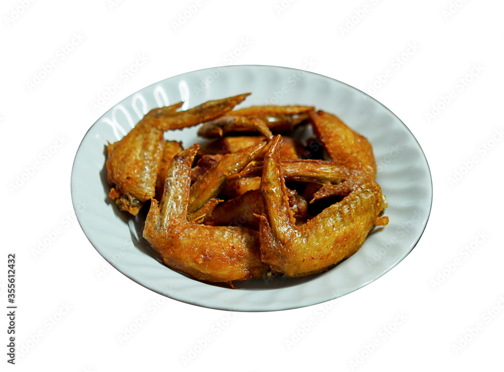 Fried chicken wings in white plate on white background Fried chicken wings in white plate on white background