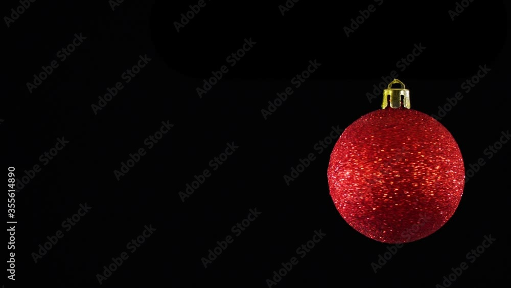 Christmas tree decorations on a black background. Festive Christmas balls on a dark, isolated. New Year tree and holiday concept. Christmas tree decorations on a black background. Festive Christmas balls on a dark, isolated. New Year tree and holiday concept.