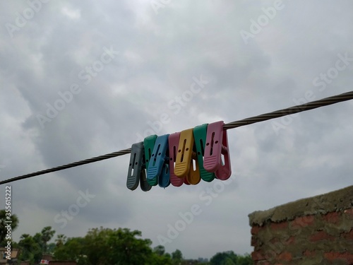 Photography Close up of some cloth hanging clips Stock Photo