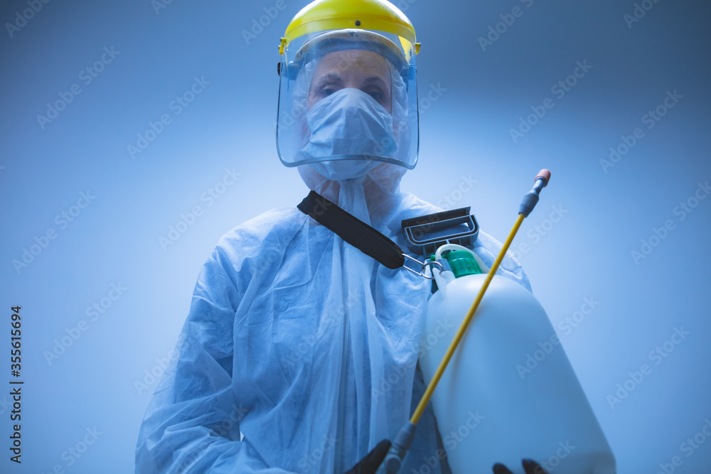 Scientist holding chemical sprayer for sterilization and