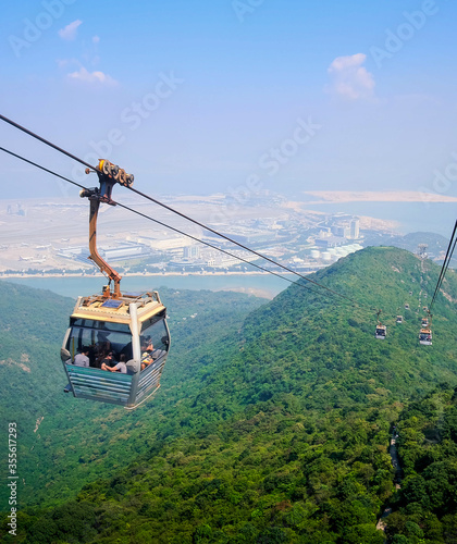 Skyline cable car with green mountains and ocean landscape background photo
