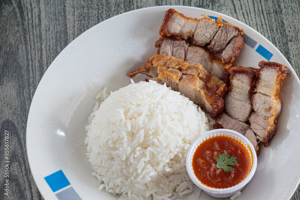 Three layers of crispy pork with rice. Three layers of crispy pork with rice.