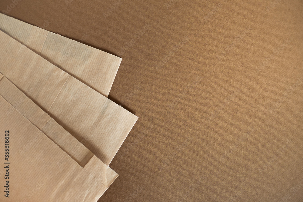 Recycling craft package on isolated brown background Recycling craft package on isolated brown background