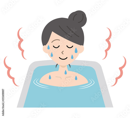 お風呂で湯船に浸かって汗をかく若い女性