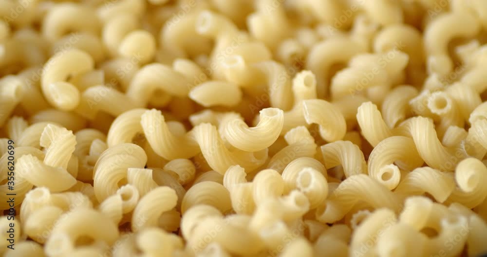 Cavatappi pasta dry rotates slowly on the table. Cavatappi pasta dry rotates slowly on the table.
