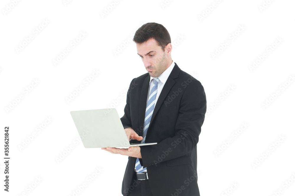 Successful and handsome businessman in a suit smiling with hand holding notebook. He serious in working on a laptop isolated on white background. Copy space Successful and handsome businessman in a suit smiling with hand holding notebook. He serious in working on a laptop isolated on white background. Copy space