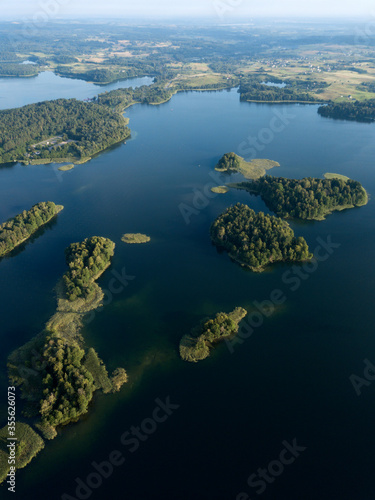  Aerial view of green islets near Trakai castle in Lithuania. Beautiful rural landscape, lake Galve, nature, summer sunny day. Environment background. © dimabucci