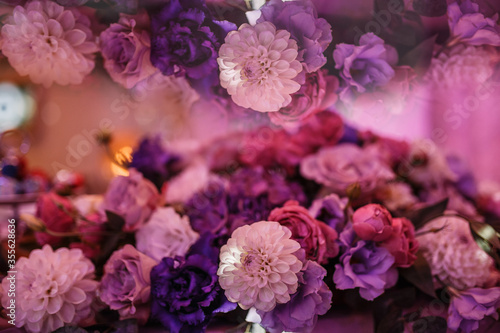 Fototapeta Naklejka Na Ścianę i Meble -  a bouquet of pink, red and purple flowers. Mirror reflection