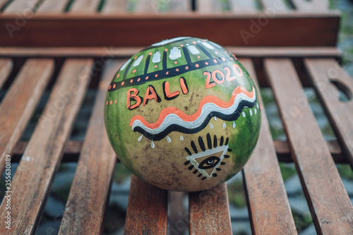 watermelon with the eye of providence symbol in a triangle and with the inscription bali 2020