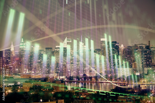 Double exposure of forex chart drawings over cityscape background. Concept of success.