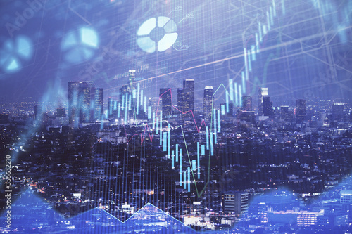 Financial graph on night city scape with tall buildings background double exposure. Analysis concept.