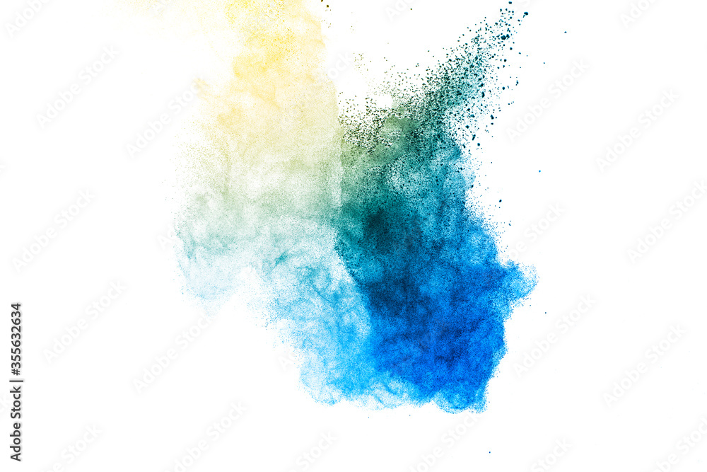 Explosion of blue and yellow dust on white background.