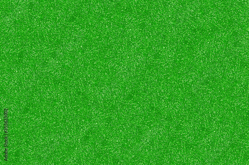 Green glitter texture christmas abstract background. Background and wallpaper. © CholladaArt