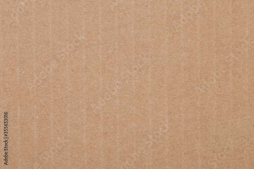 Brown paper background. Empty cardboard texture. Craft sheet © natrot