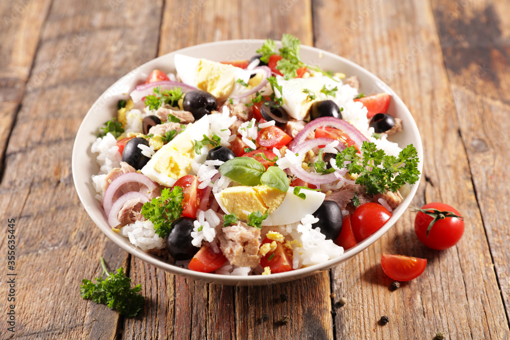 gourmet rice salad with egg, tuna, onion, tomato and tomato