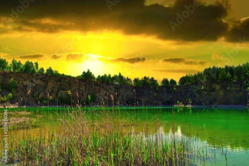 A turquoise lake on sunset. Travel and rest concept. Wonderful views and extraordinary places on earth, sunrise.