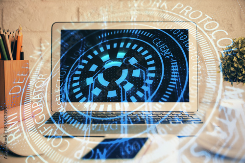 Double exposure of desktop with personal computer on background and tech theme drawing. Concept of Bigdata.