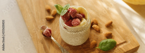 Vegan Chia Pudding with Frozen raspberry, Banana and almond on w