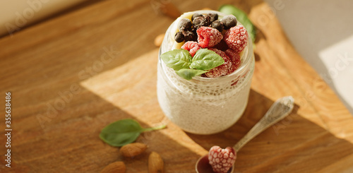 Vegan Chia Pudding with Frozen raspberry, Banana and almond on w